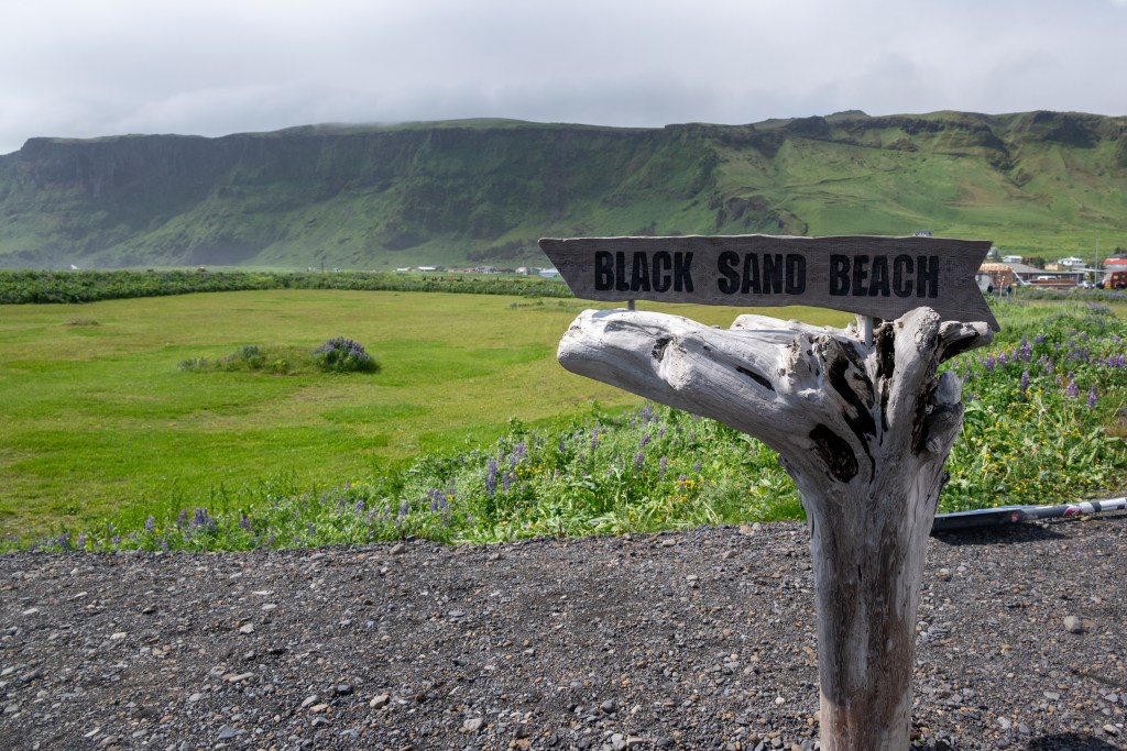 Black sand beach sign in Vik, Iceland