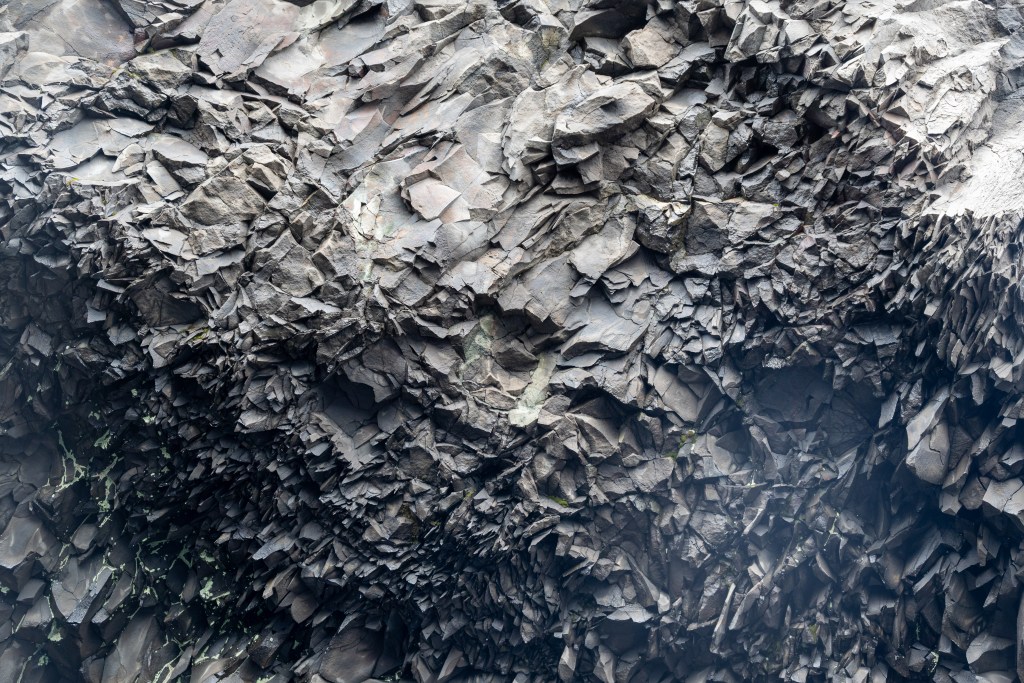 Rock formations at Reynisfjara black sand beach in Iceland