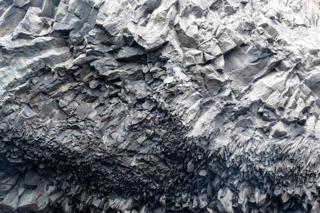 Rock formations at Reynisfjara black sand beach in Iceland